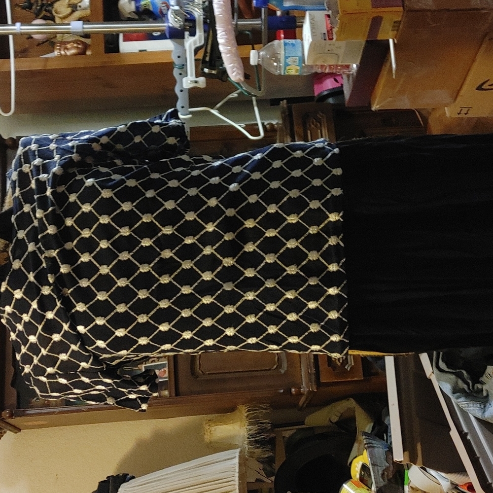 Black skort with blback and white blouse